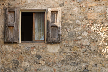Fototapeta na wymiar Open window. Detail of a open window of a old house.