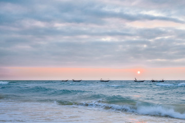 Waving boats in the sea of Weizhou Island, Beihai, Guangxi, China