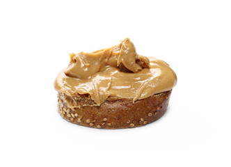 Peanut butter spread on slice of bread isolated on white background