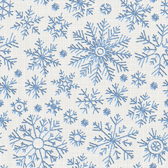 Seamless embroidery snowflakes background.