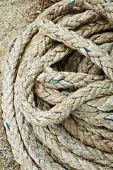 Fototapeta na wymiar Close-up of an old frayed boat rope as background