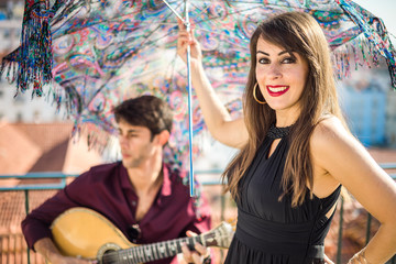 Beautiful fado singer performing with handsome portuguese guitarist player, Portugal