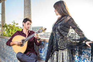 Band performing traditional music fado under pergola with azulejos in Lisbon, Portugal