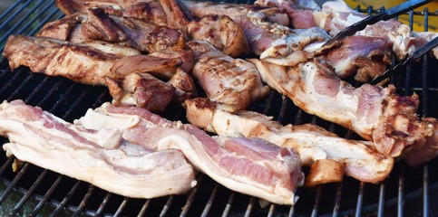 grill pork on grid in big party