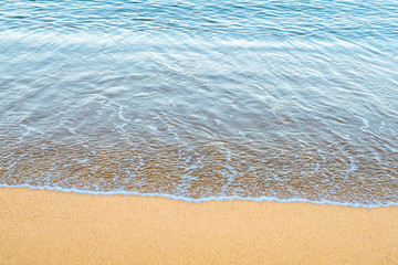 Background, Wave foam and blue ocean on the beach.