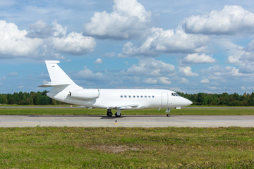 Airplane taxiing on the apron of the airport on the asphalt for take off.
