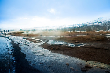 Geysir Hot Spring Area, on a cold day with steam billowing from the springs, Golden circle, Iceland