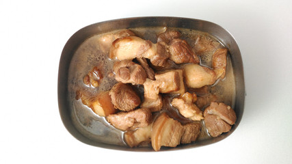 Top view of pork belly braised in soy sauce in an iron lunch box.Taiwanese traditional cuisine.
