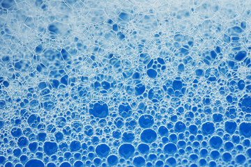 Macro bubble foam on blue background