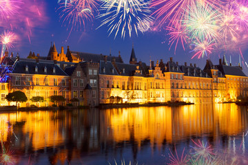 Fototapeta na wymiar Binnenhof - Dutch Parliament with old town of The Hague with fireworks, Holland
