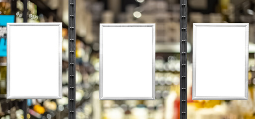 Blank white posters in aluminium frames.