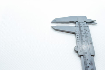 Caliper isolated on white background. Macro shot calliper or caliper
