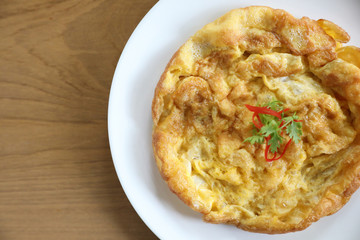 Omelette thai style on wooden background