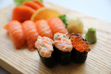 Salmon sushi and sashimi on wood plate Japanese food