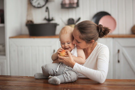 Mother Gives The Baby Apple, Mother Hugs Son