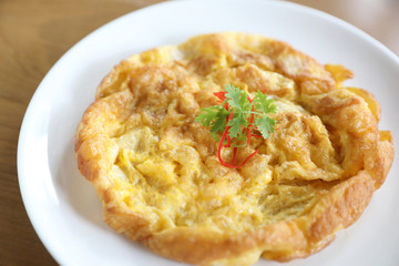 Omelette thai style on wooden background