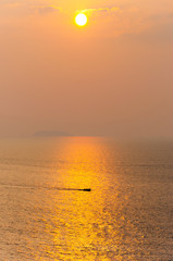Golden sunset sun on Arabian sea in Murudeshwar, Karnataka, India.