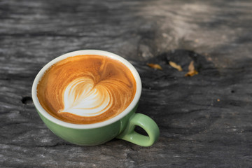 Cup of coffee on a wooden table