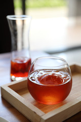 Strawberry iced tea on wooden table
