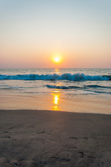 Sunset sun above the Arabian sea beach in Kochi, India.