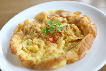 Omelette thai style on wooden background