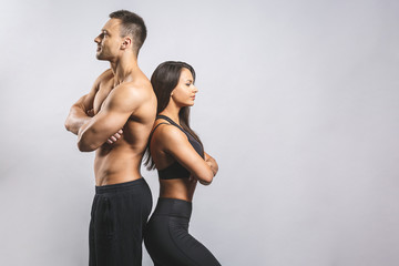 Athletic man and woman isolated over white background. Personal fitness instructor. Personal training.