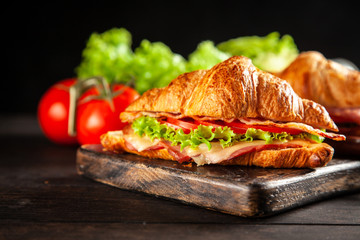 Fototapeta na wymiar Classic BLT croissant sandwiches