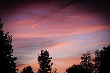 Fototapeta premium Dawn. Cloud in the sky at the back of the sun.