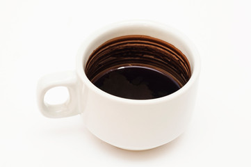 A cup of black coffee on a white background