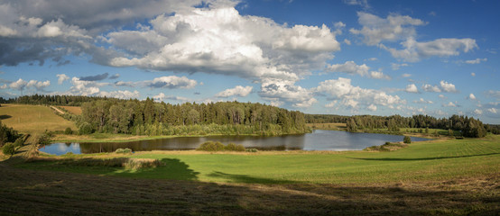 Fototapeta na wymiar Fine summer day on the bank of the lake
