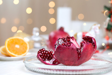 christmas and new year's eve table with Fruit Pomegranate.Fruit Pomegranate in a winter composition