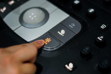 Doctor hand pressing on control panel button of ultrasound machine, Medical equipment concept