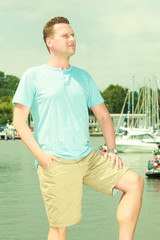 Man walking on marina during summer