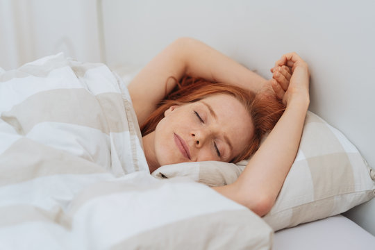 Attractive young woman enjoying a restful sleep