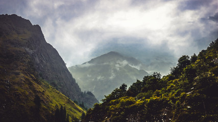 Fototapeta premium mountain wants to hide in to the cloud