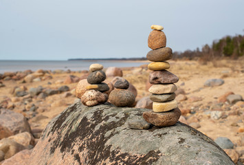 Fototapeta na wymiar balancing stones on the street sea view