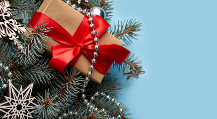 Christmas background with xmas tree and sparkle bokeh lights on wooden canvas background. Merry christmas card. Winter holiday theme. Happy New Year. Space for text. Happy Holidays