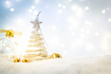 White christmas - christmas tree in snow with bokeh lights in background, retro toned