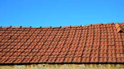 Roof with red tiles. Roof of Small country house.
