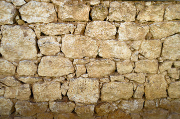 Old Stone wall which is made in a small village.
