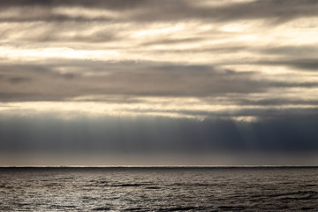 Sun Rays Through Clouds near the Ocean