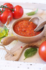 Mediterranean cuisine. Sauce of ripe tomatoes, olive oil and basil.