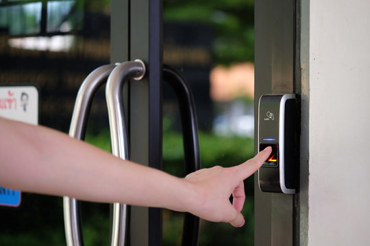 Track Employee Hours Using Biometric Fingerprint Scanner. Security, Door Access Control, Validation, Cybersecurity And Fingerprint Password, Future Technology. Business Safety Concept.