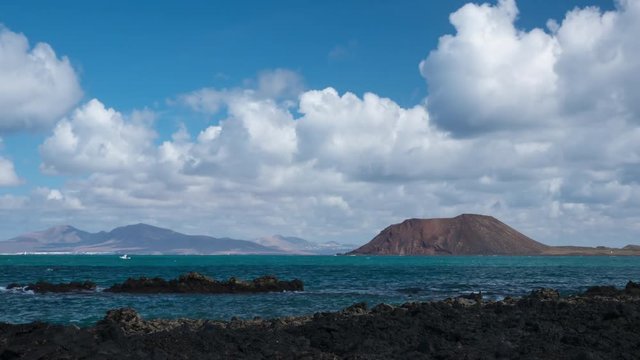view of lobos island with moving clouds