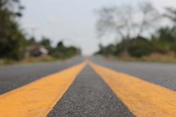 asphalt road with lines and sky