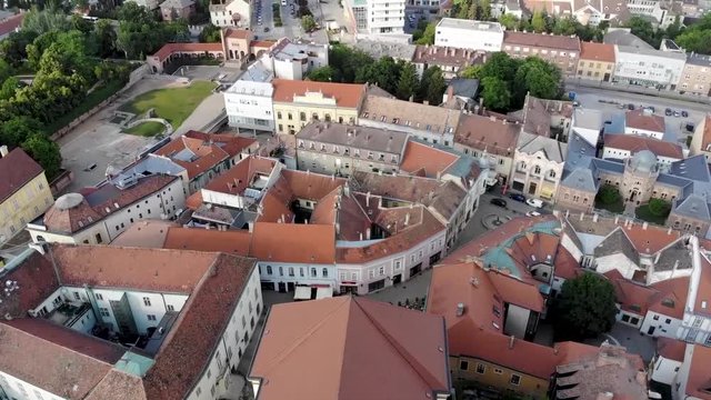 Flying over a twin towered yellow church