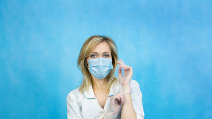 A nurse put gloves on her hands to massage the prostate in men.  Doctor proctologist with gloves...