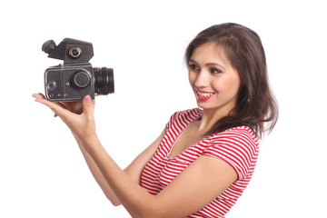 Portrait of a young woman taking a picture with a camera.  Woman taking a selfie.