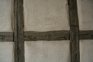  White wall with wooden beams. Background and texture. In the traditions of Germany.