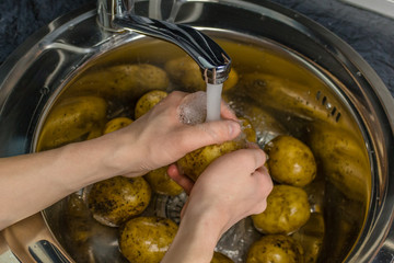 Wash vegetables under running water.